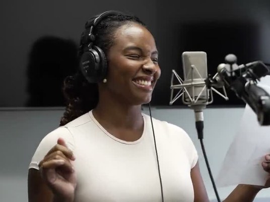 A participant recording vocals at an I Wonder studio session