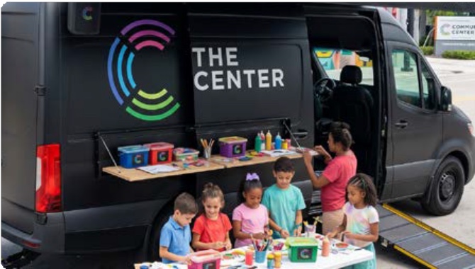 The Mobile Imagination Lab van with kids creating outside it