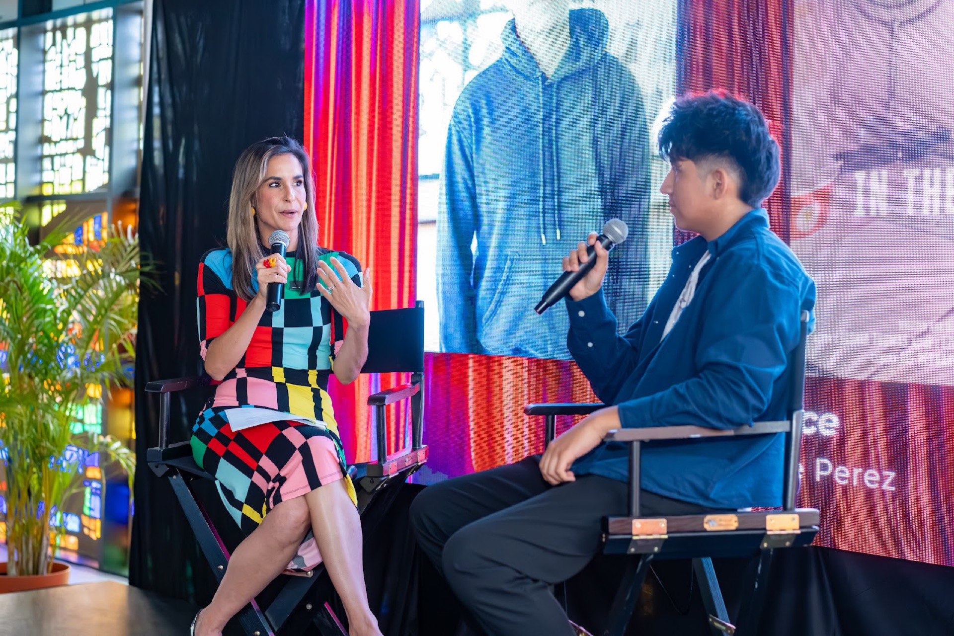 Andrea Virgin interviewing fellow Josue Perez on stage